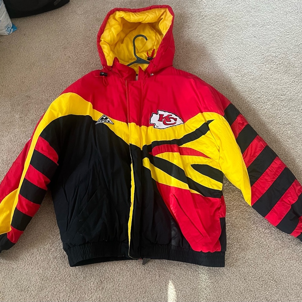 This is a NFL Kansas City Chiefs jacket with a hood. Wear it for the Super Bowl.